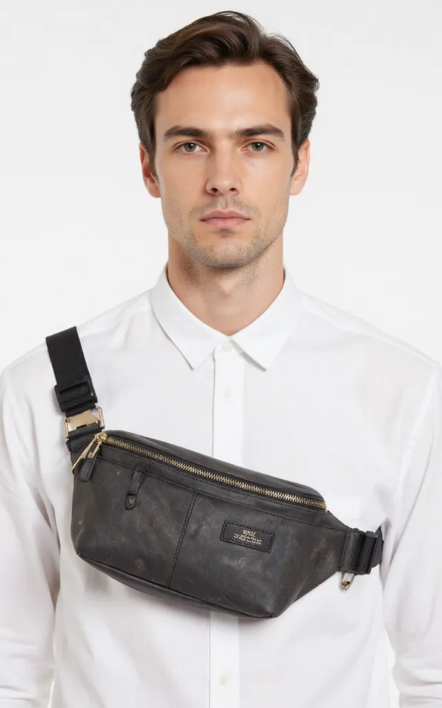 A French male model with a Waist bag, wearing a shirt, against a white background, in a front   facing close   up